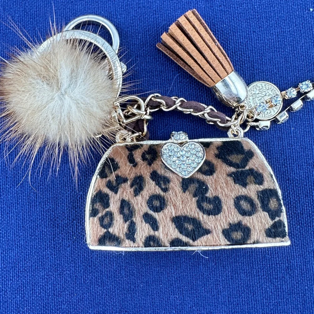 Unbranded keychain or purse charm. White, tan and black. NEW